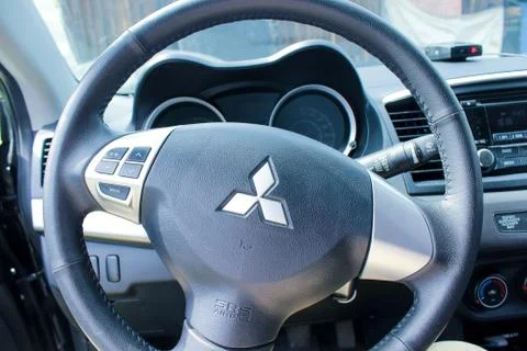 Mitsubishi machine inside the cabin. close-up of the steering wheel with airb 写真素材
