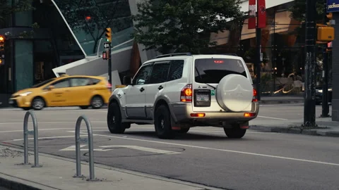 Mitsubishi SUV sitting in traffic Stock Footage 244542552