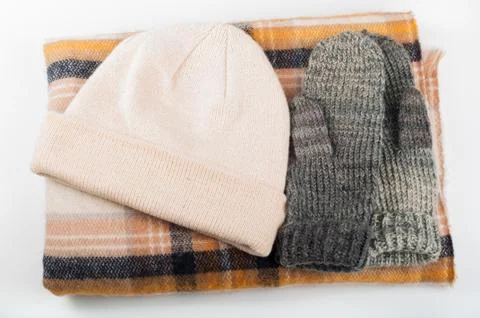 Mittens scarf hat on withe background Stock Photos