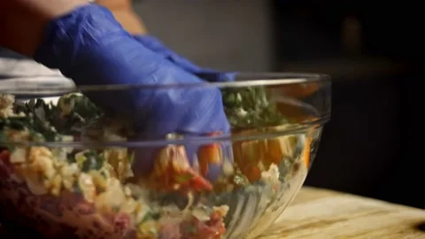 Mix all ingredients by hand using gloves. Falscher Hase recipe. 4k video recipe Stock Footage 156767887