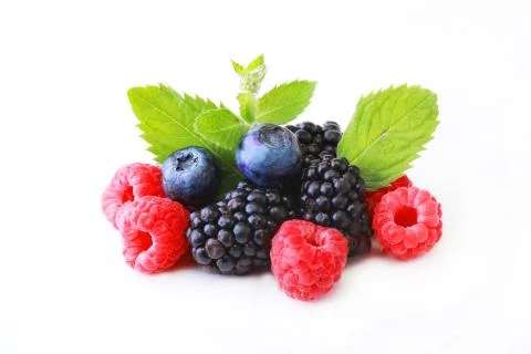 Mix berries with leaf of mint over white background Stock Photos