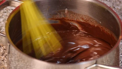 Mix chocolate in a pot Stock Footage 97946786