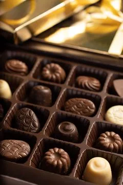 Mix of chocolates in a box. Stock Photos