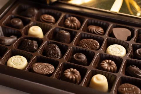 Mix of chocolates in a box. Stock Photos