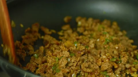 Mix chopped onion, chopped pepper and chorizo meat. Fry in a pan Stock Footage 169365209