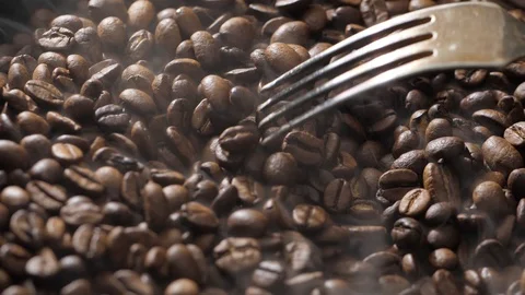 Mix coffee beans in a burning pan Stock Footage 120922345