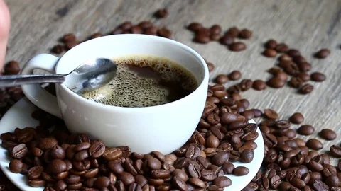 Mix coffee with a spoon Stock Footage 76536492