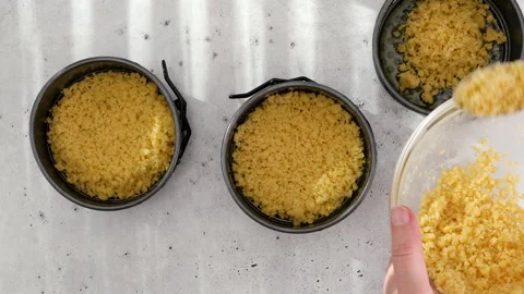 Mix of a cracker crust and melted butter for the cheesecake recipe. Stock Footage 278954591