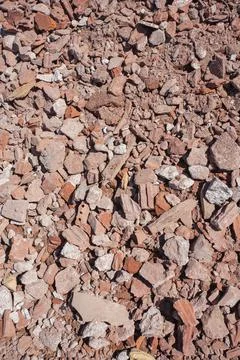 Mix of crushed red bricks and concrete from building demolition work Stock Photos