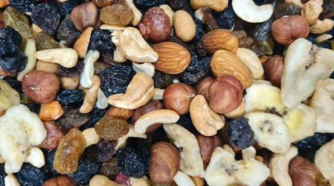 Mix of different nuts background Stock Photos