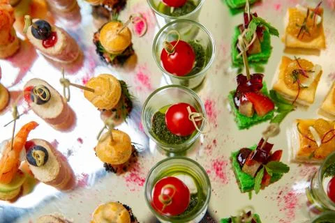 Mix of different snacks and appetizers. Spanish tapas on a table. Tapas bar.  Stock Photos