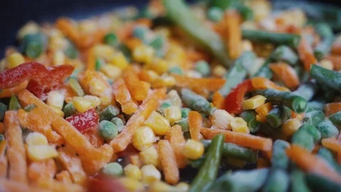 Mix Of Different Vegetables Fried In A Hot Frying Pan Stock Footage 122173856