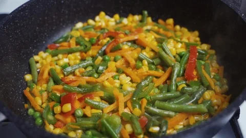 Mix Of Different Vegetables Fried In A Hot Frying Pan Video stock 122192218