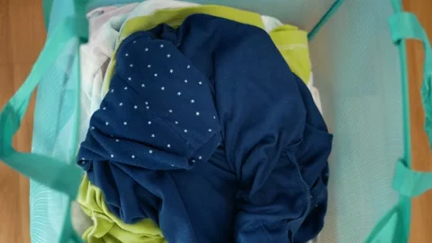 Mix dirty laundry throwing into the basket. Stock Footage 145476466