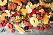 Mix Of Dried And Candied Fruit On A Wooden Background, Top View Stock Photos