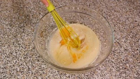 Mix eggs in milk slow motion Stock Footage 96235521