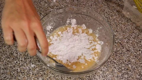 Mix flour in the dough slow motion Stock Footage 96235578