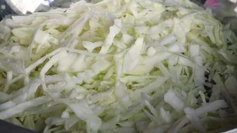 Mix fresh chopped white cabbage with your hands. Cooking a healthy salad Stock Footage 277026098