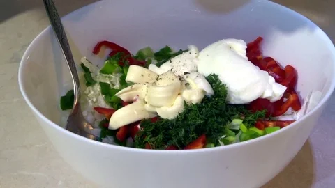 Mix fresh salad. We do it easily in a white bowl. Part 2 Stock Footage 87785632