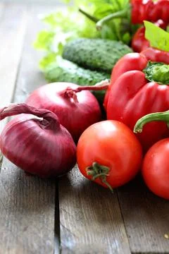 Mix of fresh vegetables on the table, onion, pepper, tomato, Stock Photos