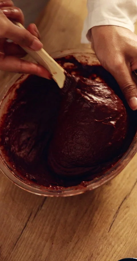 Mix, hands and baker with cake batter in kitchen for baking, dessert or cupcakes Stock Footage 343242909