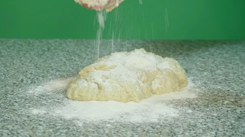 Mix with hands dough for cereals on the table top - green screen background Stock Footage 126611919