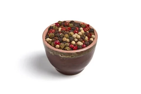 Mix of multi-colored peppercorns in a ceramic bowl isolated on white backgr.. Stock Photos