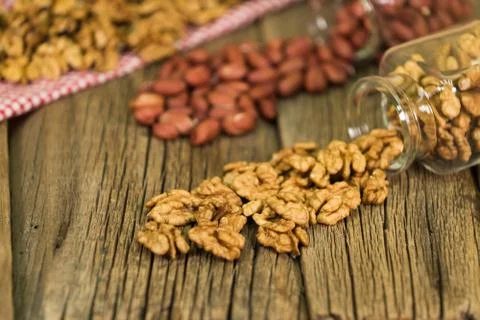 Mix of nuts in the glass jars , on the table. 스톡 사진