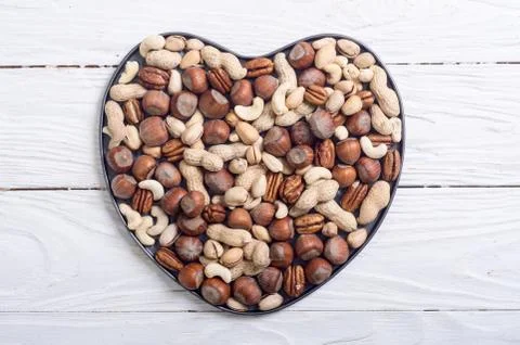 Mix of nuts in plate Stock Photos