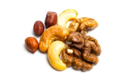 Mix of nuts on a white background. close up Stock Photos