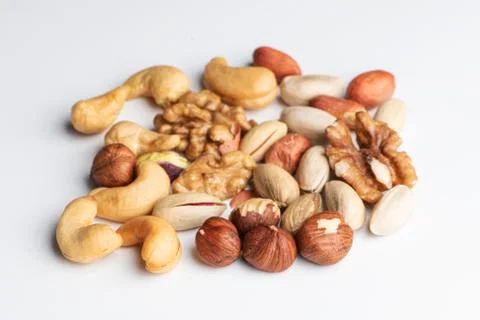 Mix of nuts on a white background Stock Photos