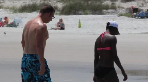 Mix-Raced Couple in Bathing Suits on Beach Stock Footage 40535360