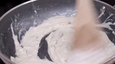 Mix the sauce in the pot Stock Footage 93730845