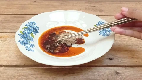 Mix the spices using chopsticks Stock Footage 145377699