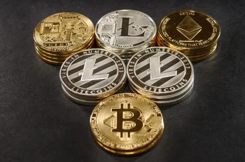 Mix of stack bitcoin, litecoin and ethereum. Cryptocurrency concept Stock Photos