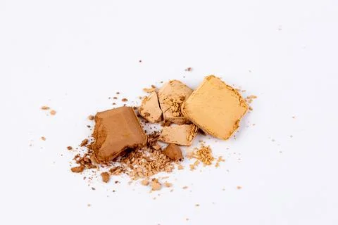 Mix of Various Earthy Pigments in Solid Form and Powdered Texture on White Stock Photos