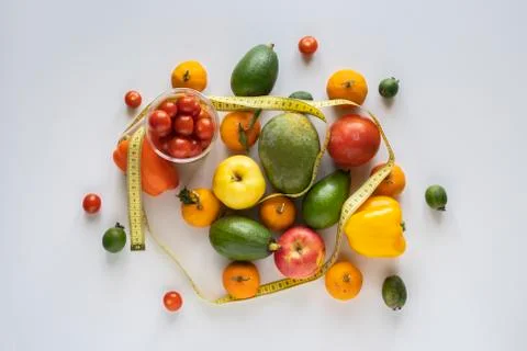 Mix of various raw fruit flat lay with a centimeter, the diet concept Stock Photos