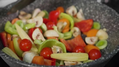 Mix the vegetable mixture in a frying pan Stock Footage 268576684