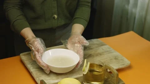Mix the yeast in water with a spoon Stock Footage 165066257