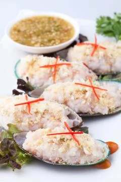 Mixed and cooked seafood on shells Stock Photos