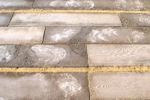 Mixed background made of stoned blocks, wooden boards and sand. Stock Photos