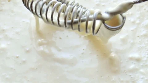 Mixed batter by hand mixer in the mixing bowl Stock Footage 78910150