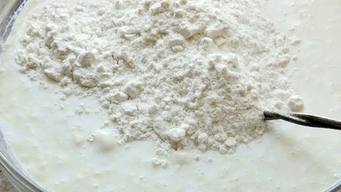 Mixed batter by hand mixer in the mixing bowl Stock Footage 78910299