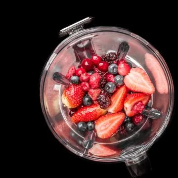 Mixed berries in blender Stock Photos
