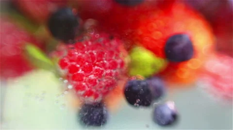 Mixed berries falling down in water Stockbeeldmateriaal 57104474