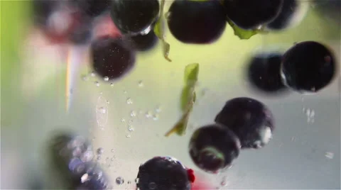 Mixed berries falling down in water Stockbeeldmateriaal 57254082