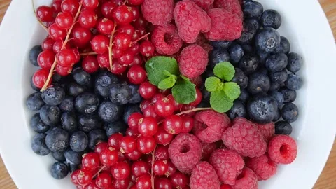 Mixed berries on a plate. Stock Footage 240275843