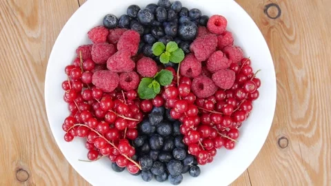 Mixed berries on a plate. Stock Footage 243475635