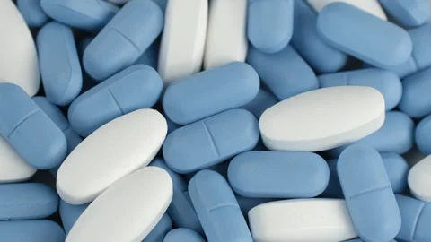 Mixed blue and white pills, rotation. Pharmaceutical Industry concept 스톡 동영상 335505908