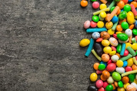 Mixed collection of colorful candy, on colored background. Flat lay, top vi.. Stock Photos